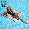 Woman lounging on a striped pool float in clear blue water with a 'Product Review Winner' badge.